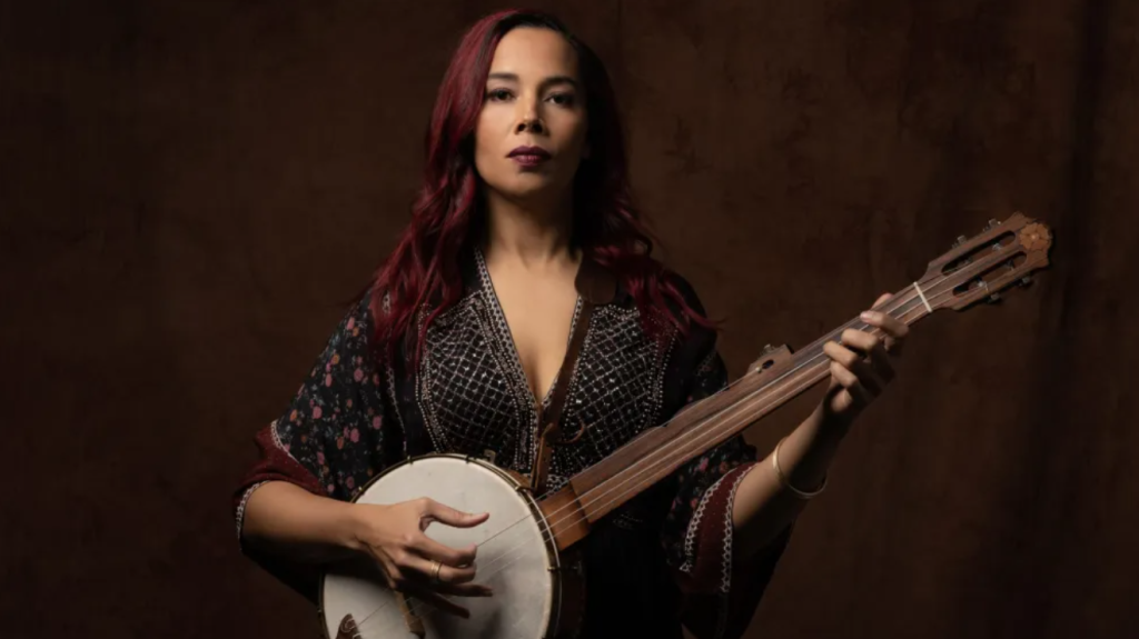 Alt Text: Rhiannon Giddens Leads Nation in Revealing the Black Roots of the Banjo. Rhiannon Giddens Photo credit: rhiannongiddens.com